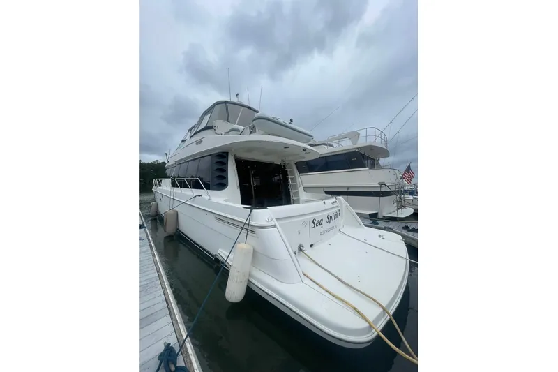 Sea Spirit Yacht Photos Pics 2004 Carver 570 Voyager Pilothouse yacht docked on a cloudy day.