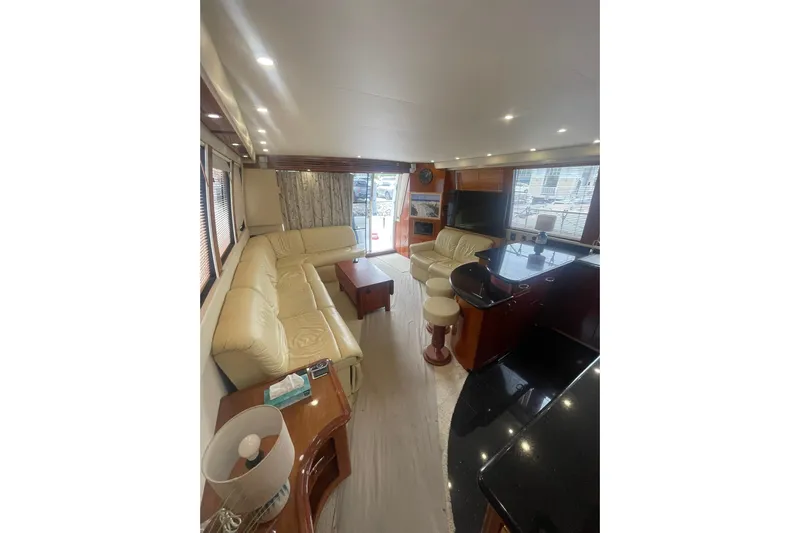 Sea Spirit Yacht Photos Pics Luxurious interior of 2004 Carver 570 Voyager Pilothouse with leather seating and modern amenities.