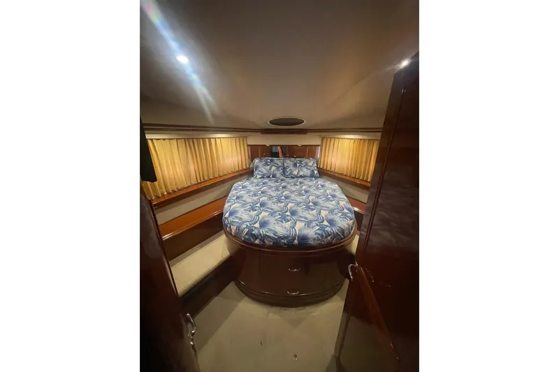 Sea Spirit Yacht Photos Pics Luxurious bedroom interior of 2004 Carver 570 Voyager Pilothouse yacht with floral bedding.