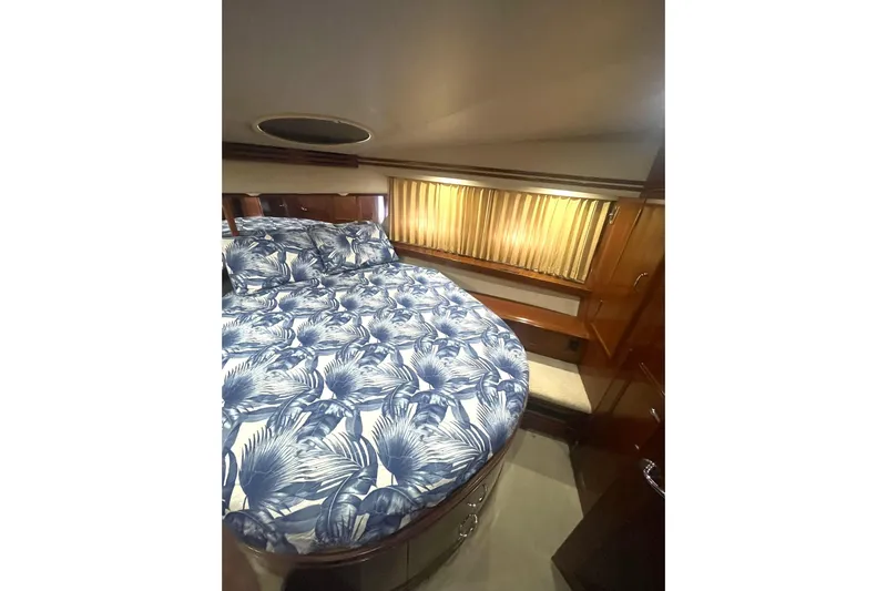 Sea Spirit Yacht Photos Pics Luxurious bedroom interior of 2004 Carver 570 Voyager Pilothouse yacht with floral bedding.