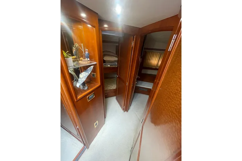 Sea Spirit Yacht Photos Pics Interior hallway of 2004 Carver 570 Voyager Pilothouse with wooden cabinetry and decor.