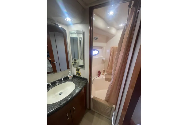 Sea Spirit Yacht Photos Pics Bathroom interior of 2004 Carver 570 Voyager Pilothouse yacht with sink and shower.
