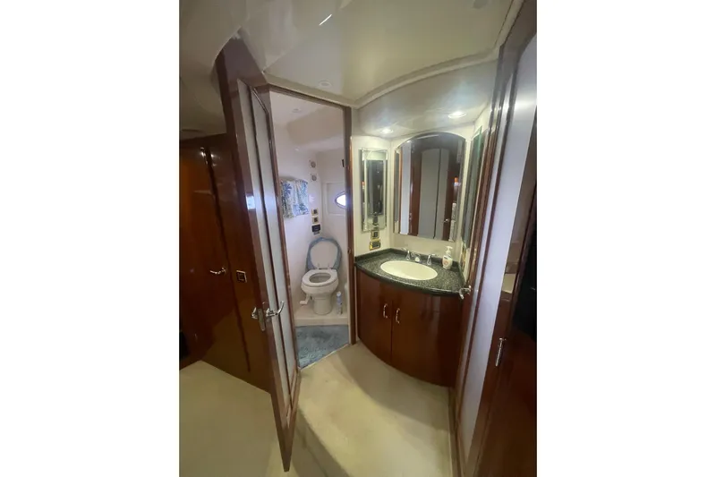 Sea Spirit Yacht Photos Pics Luxurious bathroom in 2004 Carver 570 Voyager Pilothouse yacht with elegant wood cabinetry.