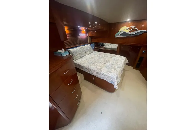 Sea Spirit Yacht Photos Pics Luxurious bedroom in 2004 Carver 570 Voyager Pilothouse yacht with elegant wood finishes.