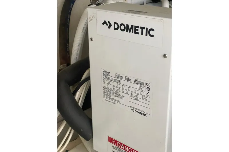 Sea Spirit Yacht Photos Pics Dometic equipment in 2004 Carver 570 Voyager Pilothouse, featuring technical specifications and warning label.