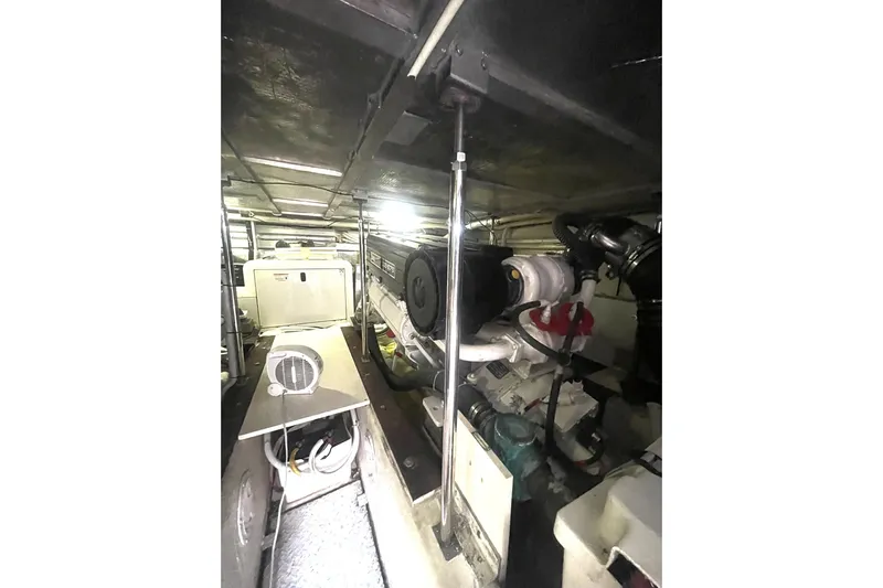 Sea Spirit Yacht Photos Pics Engine room of 2004 Carver 570 Voyager Pilothouse, showcasing mechanical components and systems.