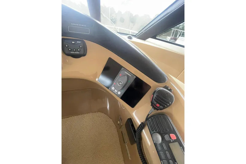 Sea Spirit Yacht Photos Pics 2004 Carver 570 Voyager Pilothouse helm with control panel and communication devices.