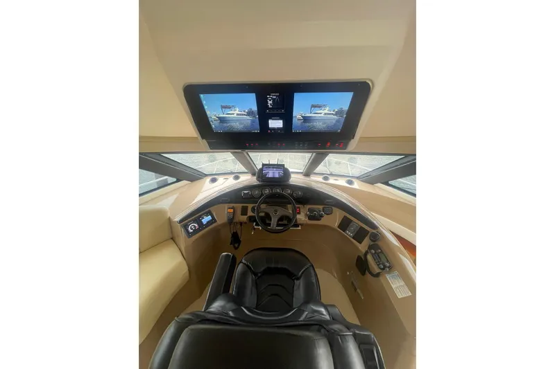 Sea Spirit Yacht Photos Pics 2004 Carver 570 Voyager Pilothouse helm with dual screens and modern controls.