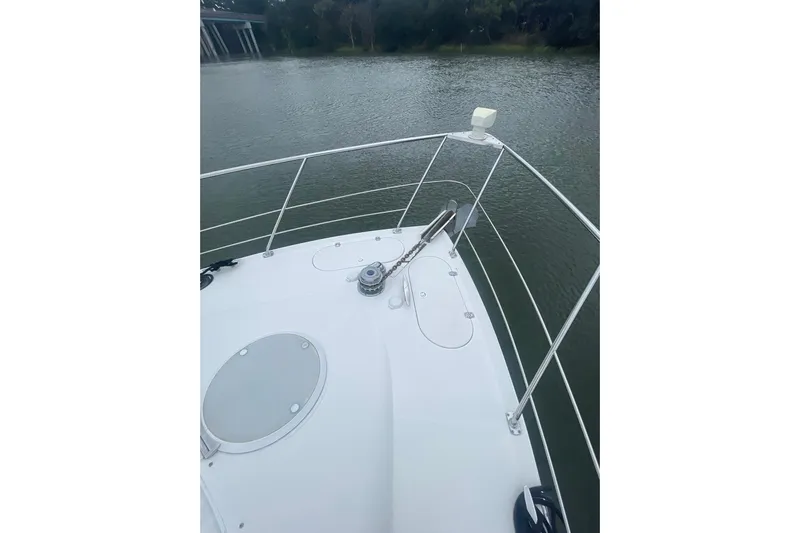 Sea Spirit Yacht Photos Pics Bow of 2004 Carver 570 Voyager Pilothouse on calm water.