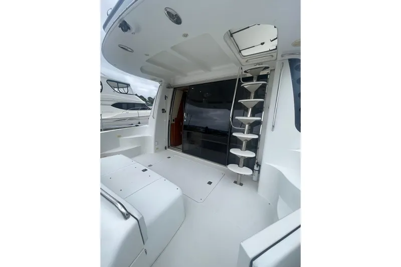 Sea Spirit Yacht Photos Pics 2004 Carver 570 Voyager Pilothouse yacht interior with spiral staircase and sleek design.