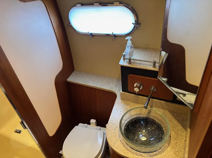 Cruise Prop Too Yacht Photos Pics Luxurious bathroom in 2010 Tiara Yachts 3900 Sovran with glass sink and modern fixtures.