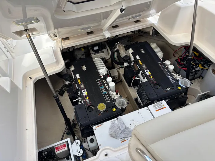 Cruise Prop Too Yacht Photos Pics Engine compartment of 2010 Tiara Yachts 3900 Sovran, showcasing dual engines and mechanical components.