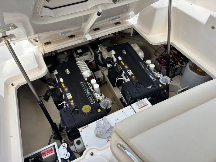 Cruise Prop Too Yacht Photos Pics Engine compartment of 2010 Tiara Yachts 3900 Sovran, showcasing dual engines and components.