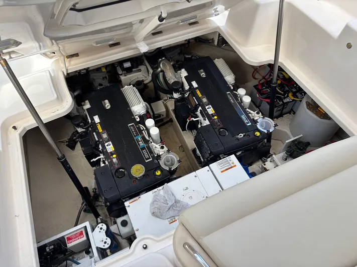 Cruise Prop Too Yacht Photos Pics Engine compartment of 2010 Tiara Yachts 3900 Sovran, showcasing dual engines and components.