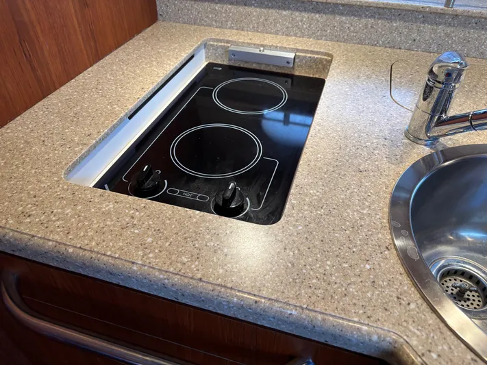 Cruise Prop Too Yacht Photos Pics 2010 Tiara Yachts 3900 Sovran galley with electric stovetop and sink.