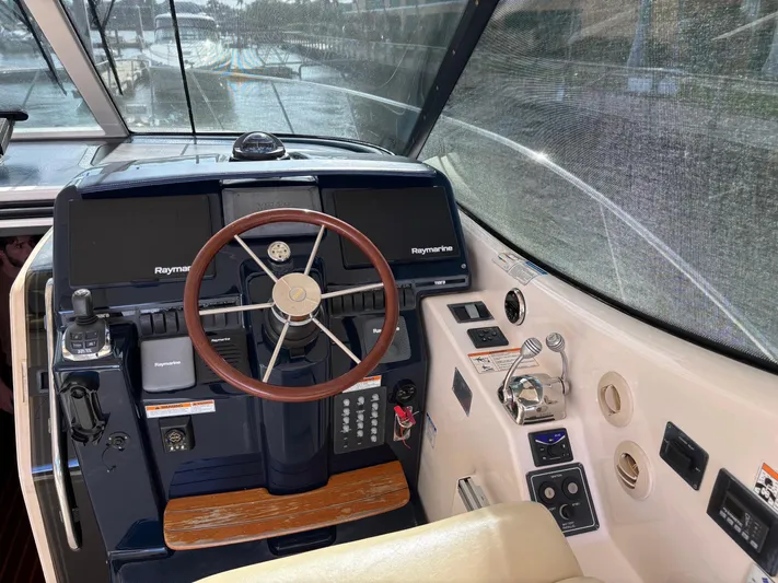 Cruise Prop Too Yacht Photos Pics 2010 Tiara Yachts 3900 Sovran helm with advanced navigation controls and steering wheel.