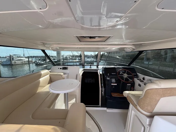 Cruise Prop Too Yacht Photos Pics Interior of 2010 Tiara Yachts 3900 Sovran, featuring helm and seating area.