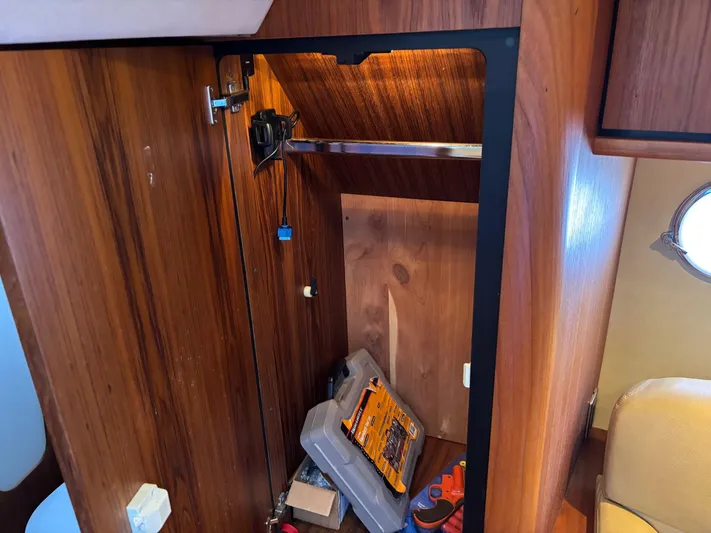 Cruise Prop Too Yacht Photos Pics Wooden interior storage on 2010 Tiara Yachts 3900 Sovran, with tools and equipment.