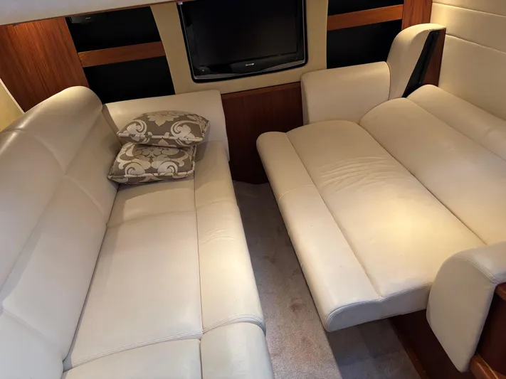 Cruise Prop Too Yacht Photos Pics Luxurious interior of 2010 Tiara Yachts 3900 Sovran with cream leather seating and TV.