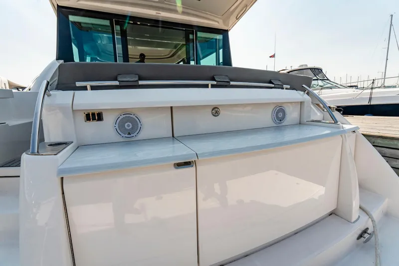  Yacht Photos Pics 2019 Tiara Yachts C49 Coupe, rear view, showcasing sleek design and modern features.