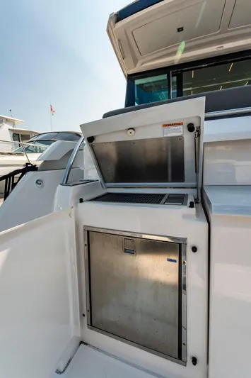  Yacht Photos Pics 2019 Tiara Yachts C49 Coupe, open storage compartment on deck.