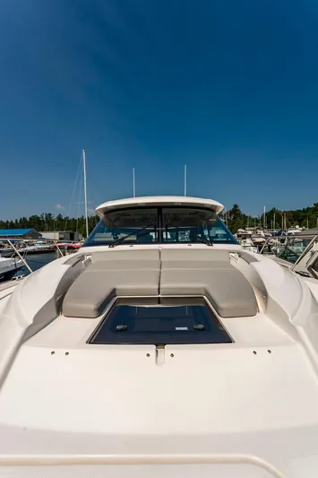  Yacht Photos Pics 2019 Tiara Yachts C49 Coupe on water, showcasing sleek design and luxury features.