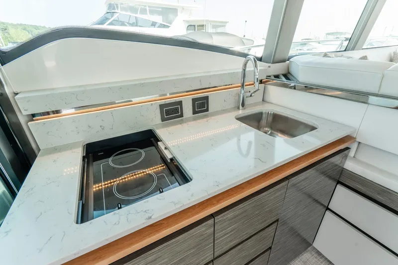  Yacht Photos Pics Modern kitchen in 2019 Tiara Yachts C49 Coupe with sleek countertops and appliances.