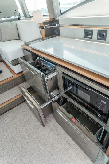  Yacht Photos Pics Luxurious 2019 Tiara Yachts C49 Coupe interior with modern kitchen appliances.