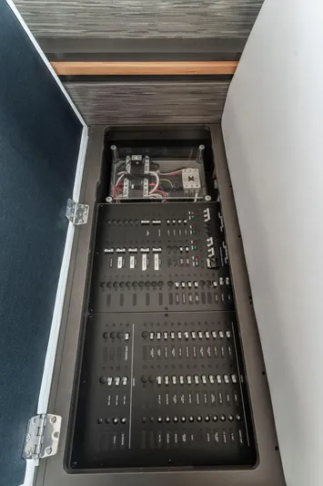  Yacht Photos Pics Electrical panel inside 2019 Tiara Yachts C49 Coupe, showcasing wiring and circuit breakers.