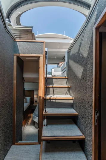  Yacht Photos Pics 2019 Tiara Yachts C49 Coupe interior with wooden stairs and modern design.