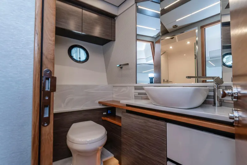  Yacht Photos Pics Luxurious bathroom in 2019 Tiara Yachts C49 Coupe with modern fixtures and elegant design.