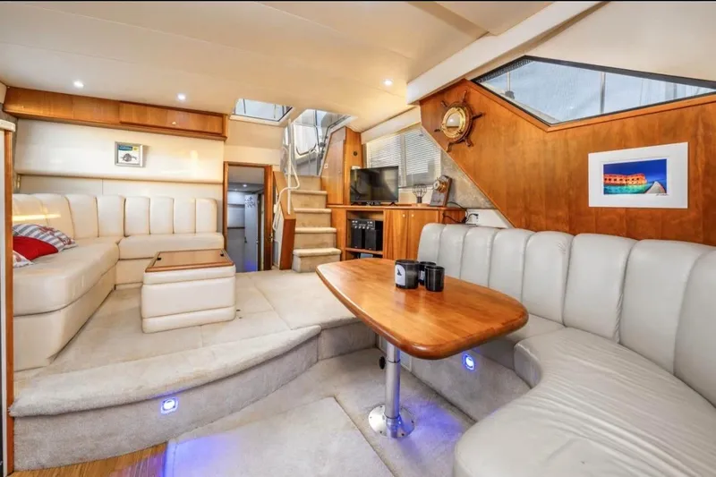  Yacht Photos Pics Luxurious interior of a 1998 Silverton 372 Motor Yacht with plush seating and wooden accents.