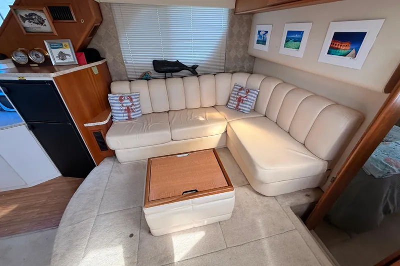  Yacht Photos Pics Interior of 1998 Silverton 40 Convertible yacht with cream leather seating and nautical decor.