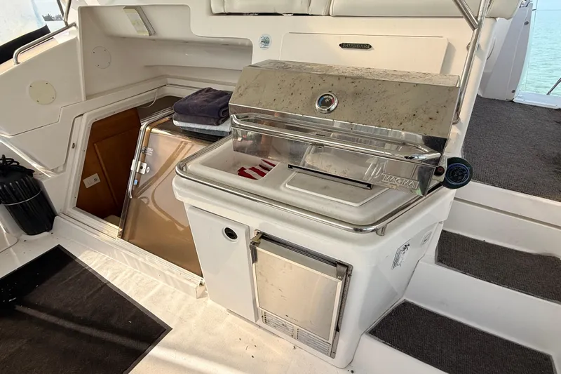  Yacht Photos Pics 1998 Silverton 40 Convertible yacht with built-in Magma grill and storage compartment.