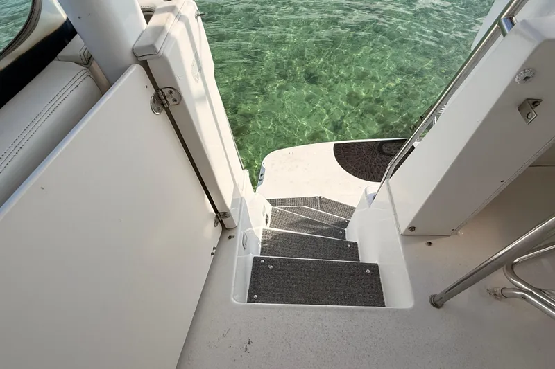  Yacht Photos Pics Stairway on 1998 Silverton 40 Convertible yacht leading to clear water.