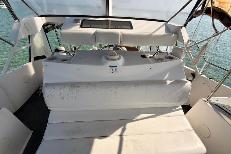  Yacht Photos Pics 1998 Silverton 40 Convertible boat interior with helm and seating, overlooking water.