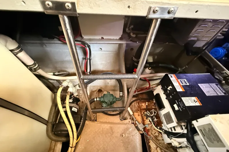  Yacht Photos Pics Engine room of a 1998 Silverton 40 Convertible boat, showing wiring and mechanical components.