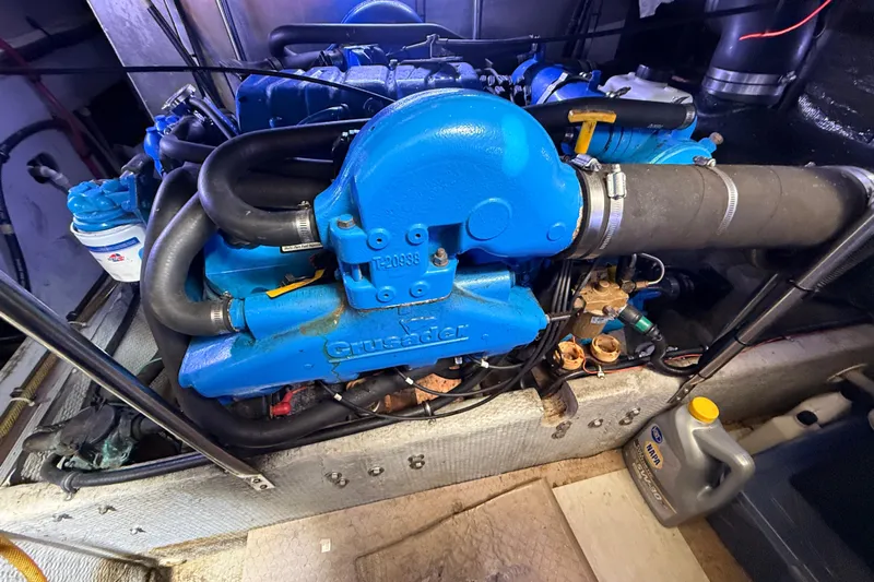  Yacht Photos Pics 1998 Silverton 40 Convertible engine, featuring a blue Crusader motor in a clean engine room.