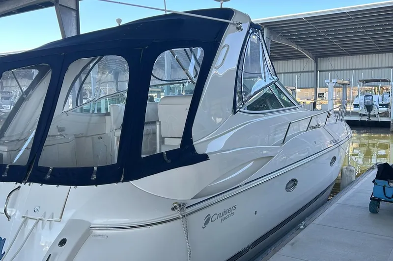 Ursula Yacht Photos Pics 2006 Cruisers Yachts 370 Express docked in a marina, featuring a sleek white design.