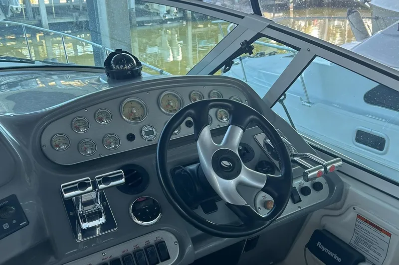 Ursula Yacht Photos Pics Helm of 2006 Cruisers Yachts 370 Express with steering wheel and instrument panel.