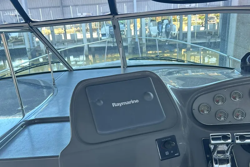 Ursula Yacht Photos Pics 2006 Cruisers Yachts 370 Express helm with Raymarine navigation system.