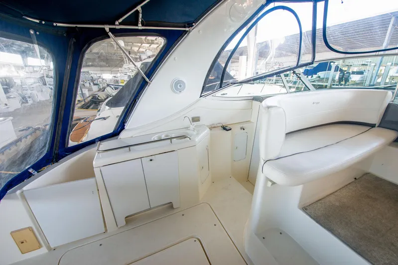 Ursula Yacht Photos Pics 2006 Cruisers Yachts 370 Express interior with white seating and cabinetry.