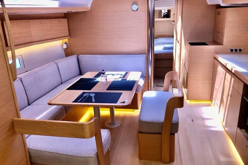  Yacht Photos Pics Interior of 2020 Dufour 430 yacht, featuring modern dining area and kitchen.