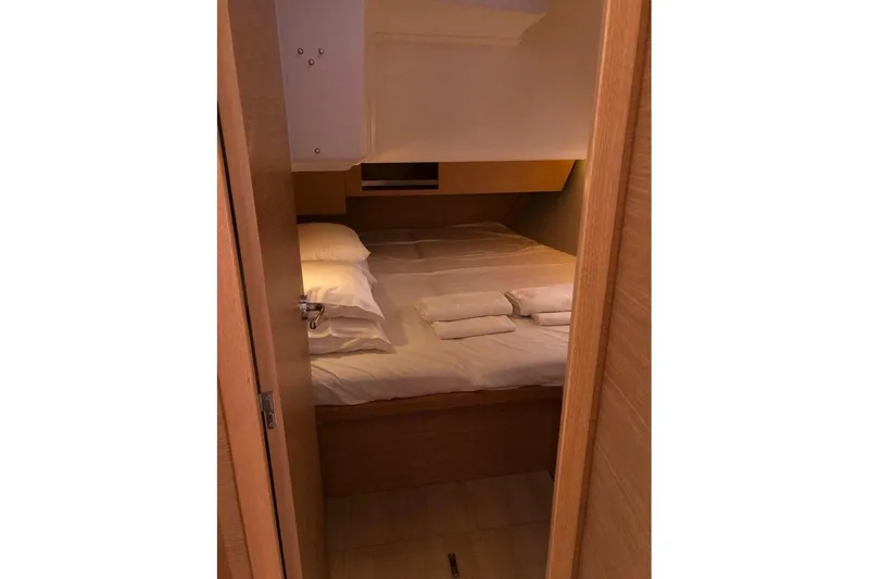  Yacht Photos Pics Cozy cabin interior of 2020 Dufour 430 yacht with neatly arranged bedding.