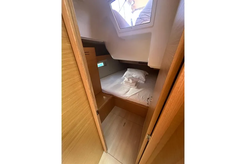  Yacht Photos Pics 2020 Dufour 430 yacht cabin interior with bed and window view.