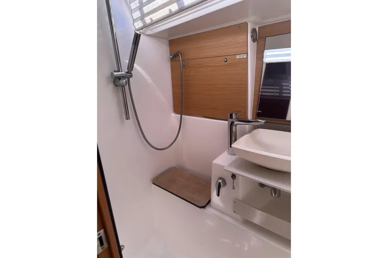  Yacht Photos Pics Modern bathroom in 2020 Dufour 430 yacht with sleek fixtures and wooden accents.