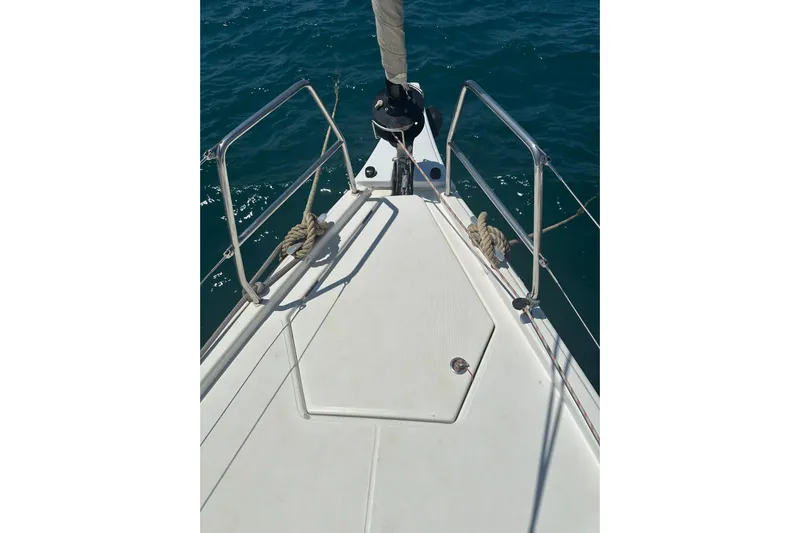  Yacht Photos Pics Bow of 2020 Dufour 430 sailboat with stainless steel railings on open sea.