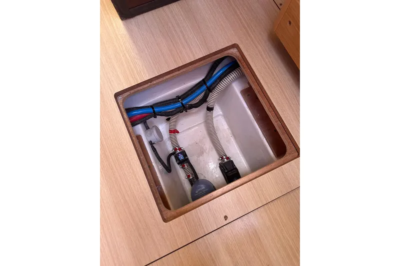  Yacht Photos Pics Bilge compartment of 2020 Dufour 430 yacht with visible hoses and pump.