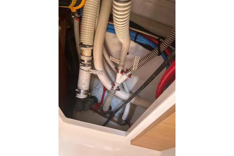  Yacht Photos Pics Engine compartment of 2020 Dufour 430 yacht showing hoses and fittings.