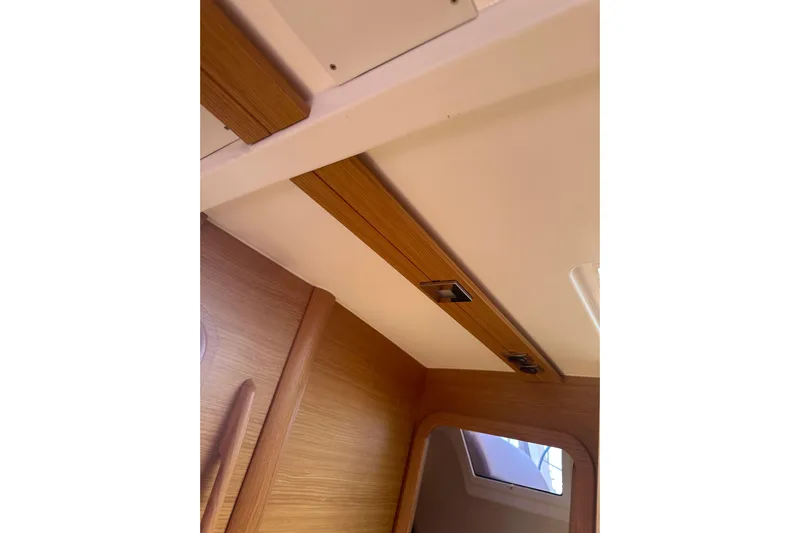  Yacht Photos Pics Interior view of 2020 Dufour 430 yacht, featuring wooden paneling and ceiling details.